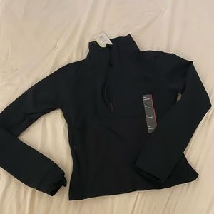 Black long sleeve athletic top. Half zip. Tight fitting, size XS. New with tags